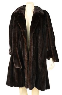 3/4 Length Brown Mink Coat, having notched collar, banded cuffs, side slip pockets and removable sash, fur is supple, size medium.