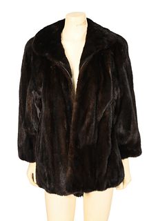 Brown Mink Jacket, having rounded collar, straight sleeves, side slip pockets and front zip closure, fur is supple, size medium.