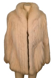 White Rabbit Fur Car Coat, having stand up collar, side slip pockets and front toggle closure, fur is supple, size medium. 