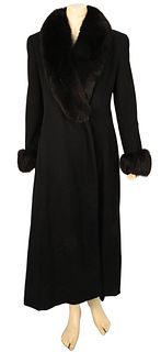 Black Wool Fur Trimmed Coat by Searle, ankle length, having front slip pockets, and large fur shawl collar and cuffs, good condition, size 6.