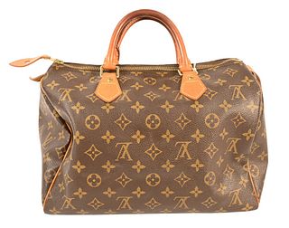 Louis Vuitton Canvas Logo Speedy Handbag, having double handle, single compartment, interior slip pocket, good patina on leather, some wear to leather