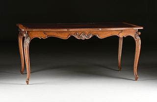 A LARGE FRENCH PROVINCIAL STYLE LEATHER TOPPED WALNUT BUREAU PLAT, SECOND-HALF 20TH CENTURY,