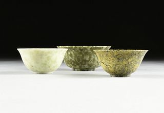 A GROUP OF THREE FOOTED JADE BOWLS, CHINESE, ATTRIBUTED TO THE REPUBLIC PERIOD (1912-1949),