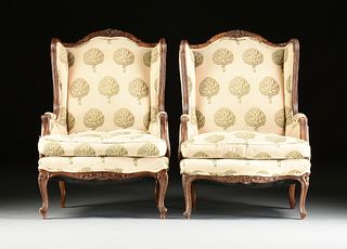 A PAIR OF LOUIS XV STYLE UPHOLSTERED AND CARVED WALNUT BERGÈRES A L'OREILLE, SECOND-HALF 20TH CENTURY,