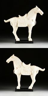 A PAIR OF VINTAGE TANG DYNASTY STYLE CARVED BONE TILED HORSES, MID/LATE 20TH CENTURY,