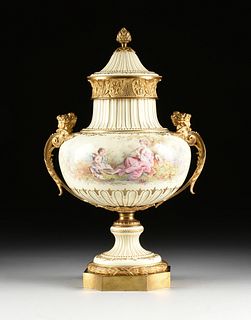 A SÈVRES STYLE ORMOLU MOUNTED AND HAND PAINTED PORCELAIN LIDDED URN, SIGNED, LATE 19TH/EARLY 20TH CENTURY, 