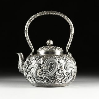A JAPANESE OVERSIZED REPOUSSÉ SILVER TEAPOT, JAPANESE TERRITORY STAMP, 20TH CENTURY,
