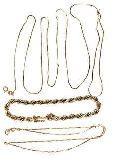 Three Piece 14 Karat Gold Lot, to include two thin gold chains, along with a twisted bracelet, each marked on the clasp, total weight 19.3 grams.