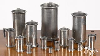 Fourteen graduated French pewter measures