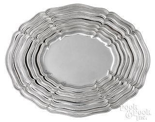 Set of eight graduated German 830 silver trays
