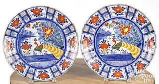 Pair of Delft polychrome peacock chargers