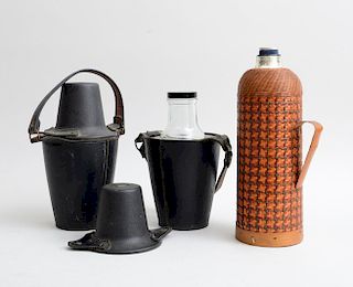TWO STITCHED LEATHER BOTTLE HOLDERS AND A WICKER-BOUND MERCURY GLASS CARAFE