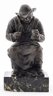 Bronze Figural Sculpture Of A Seated Man