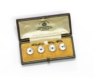 A cased set of four gold sapphire and mother-of-pearl buttons,
