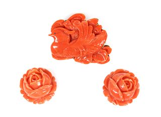An Asian carved coral plaque brooch,