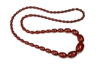 A cherry coloured Bakelite bead necklace,