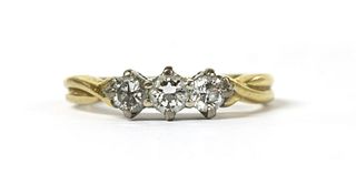 An 18ct gold three stone diamond ring,
