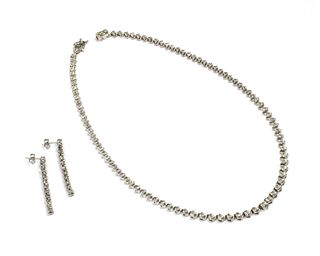 A silver diamond set necklace and earrings suite,