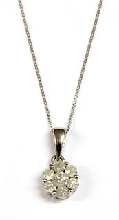 A white gold diamond daisy cluster pendant,