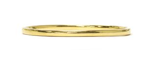 An Italian gold hollow hinged oval bangle,