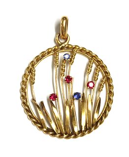 A gold ruby and sapphire pendant,