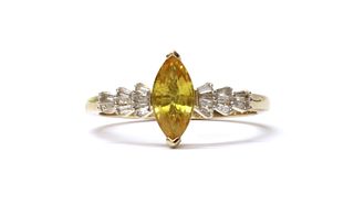 A gold yellow sapphire and diamond ring,