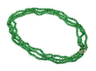 A three row uniform jade bead necklace,