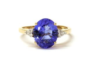 An 18ct gold tanzanite and diamond ring,