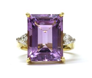 An 18ct gold amethyst and diamond three stone ring,