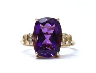 A gold amethyst and diamond ring,