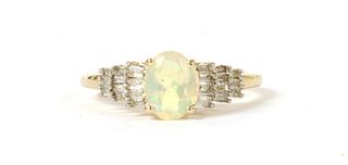 A gold opal and diamond ring,