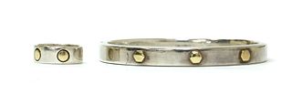 A sterling silver and gold bangle,