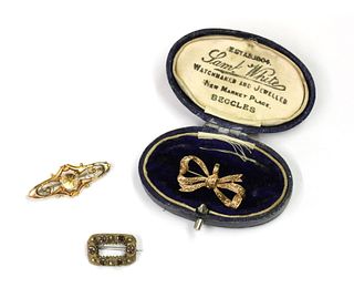 Three gold brooches,