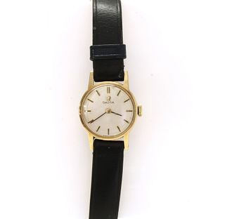 A ladies' gold Omega mechanical strap watch,