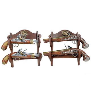 (4) Four Decorative Fire arms with wooden base