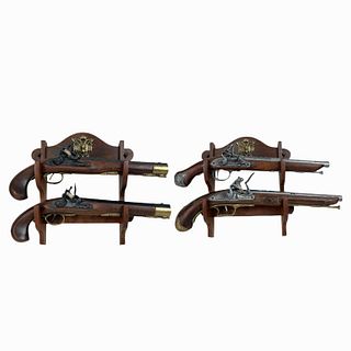 (4) Four Decorative Fire arms with wooden base.