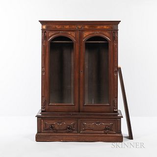 Victorian Walnut Library Cabinet, 19th century, the rectangular top and case with foliate panel detailing, pair of glass-front doors ab
