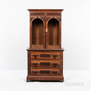 Victorian Walnut Library Cabinet on Bureau, America, 19th century, molded cornice above two glass-front doors, three long drawers below