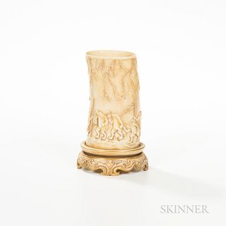 Royal Worcester Porcelain Tusk Vase, England, 1886, ivory stained and molded with marching frogs below foliate branches, and set atop a