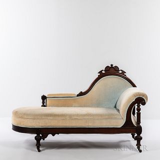 Renaissance Revival Carved Walnut Recamier, America, 19th century, carved cresting over a carved and molded frame with blue upholstery,