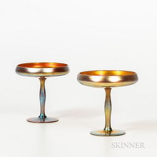 Pair of Steuben Gold Aurene Glass Compotes, Corning, New York, early 20th century, shallow bowls with inverted rims set on stems and ro