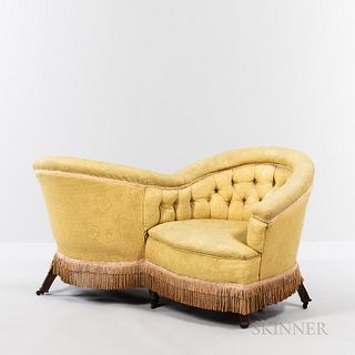 Victorian TÃªte-Ã -tÃªte, 19th century, tufted yellow upholstery with skirt of gold tassels and fringe, set on turned wooden legs, ht. 29,