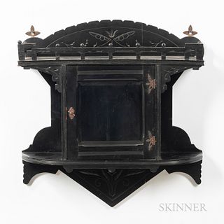 Eastlake-style Ebonized Wall Cabinet, 19th century, triangular crest with foliate carving above single glass-front door, reticulated an