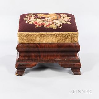Empire Needlepoint-upholstered Mahogany Veneer Footstool, 19th century, featuring needlepoint of a squirrel set in a floral wreath, ht.