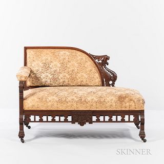 Victorian Upholstered Walnut Recamier, 19th century, Asian-style carved frame featuring a winged dragon, floral upholstery including ar