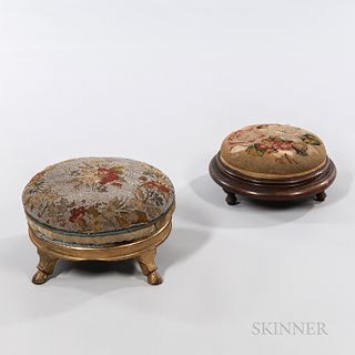 Two Victorian Needlework Footstools, each with floral decoration, one beaded and with gilded base and hoof feet, dia. 13; and one on a