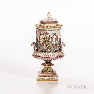 Capodimonte Covered Vase, polychrome enameled and gilded classical figures in high relief, scrolled handles, ht. 19 1/2 in.  Provenance