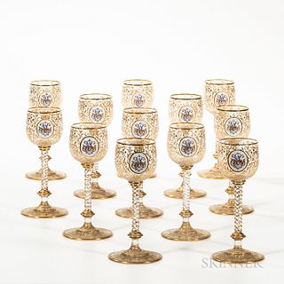 Twelve Moser Glass Goblets, Czech, gold and enamel decorated, each with a central monogrammed cartouche against a field of scrolled fol
