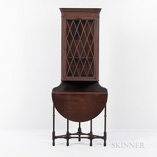 Reproduction Georgian Painted Mahogany Corner Cupboard, 20th century, dentil-molded cornice above a mullioned glass door and shelved in