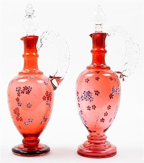 A Pair of Enameled Cranberry Glass Ewers Height 11 1/2 inches.